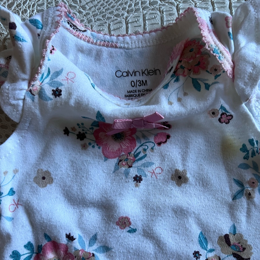 Assorted newborn onesies